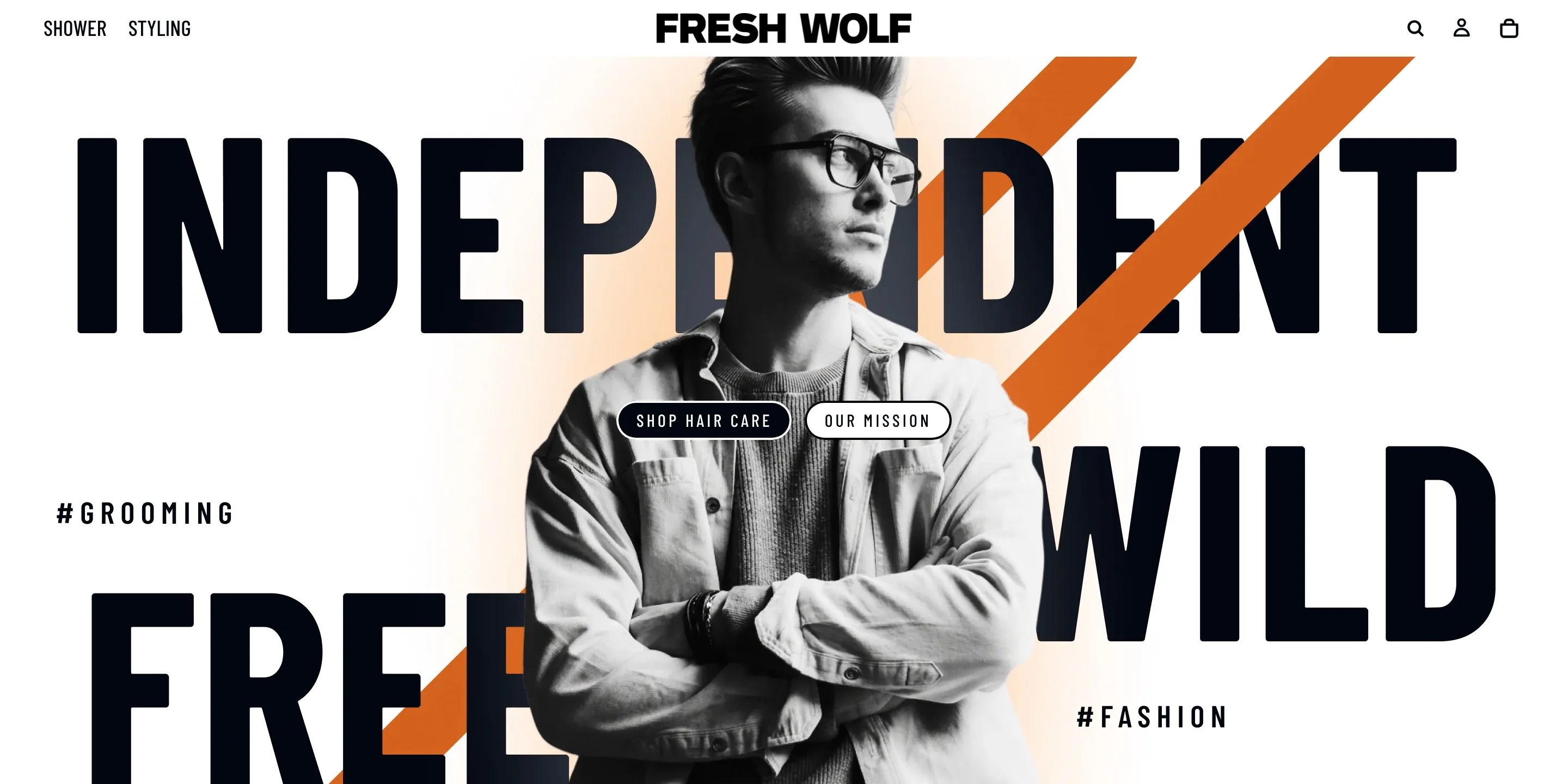 Fresh Wolf home page: INDEPENDENT, WILD, FREE in tall type around a model in glasses, with an orange slash